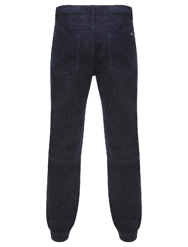 baku-cotton-corduroy-elastic-cuffed-trousers-in-sky-captain-navy-tokyo-laundry